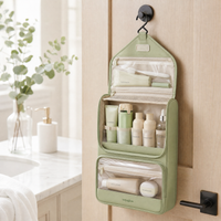 voyaglow sage green hanging wash bag in a bright bathroom