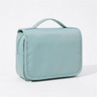 Mint wash bag folded closed with carry handle 4K