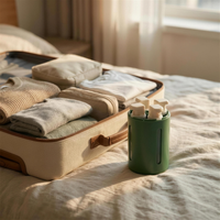 Four spray bottles next to open suitcase travel scene 4K