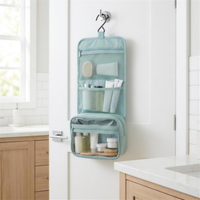 Wash bag hanging open on bathroom door 4K